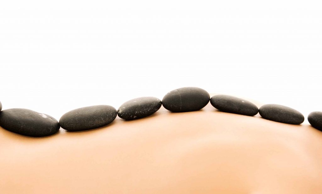 Massage with hot stones